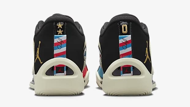 Rear view of white, black, and red Jordan Tatum 1 sneakers.